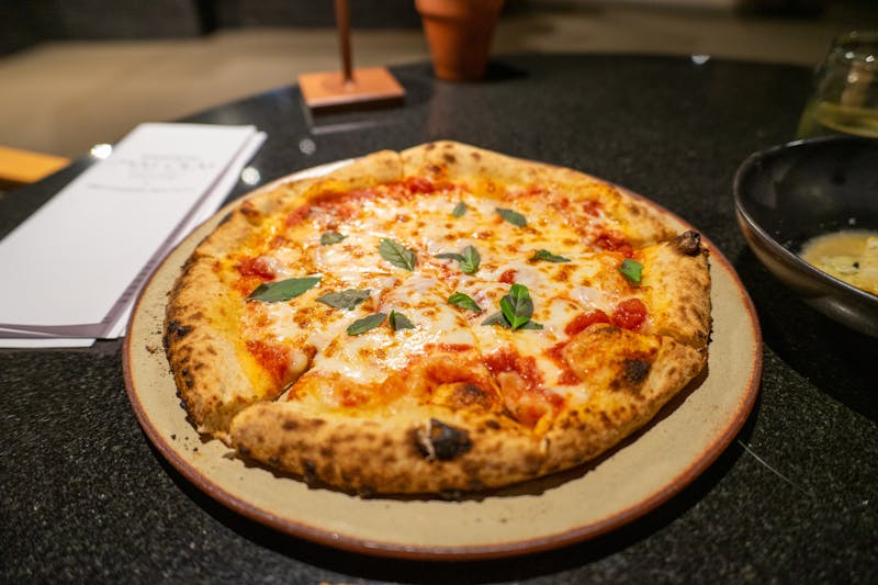 Margherita pizza luce — classic stone-baked pizza